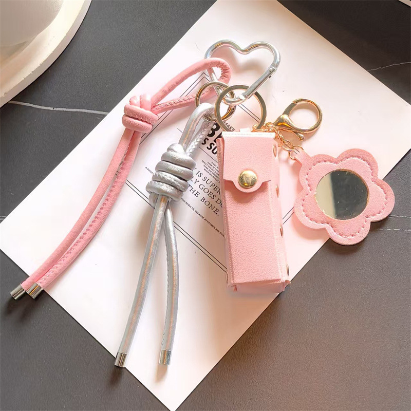 Espejo de cuero transfronterizo lápiz labial bolsas de llaves creativas flores portátiles maquillaje espejo bolsas colgantes accesorios de llaves PU