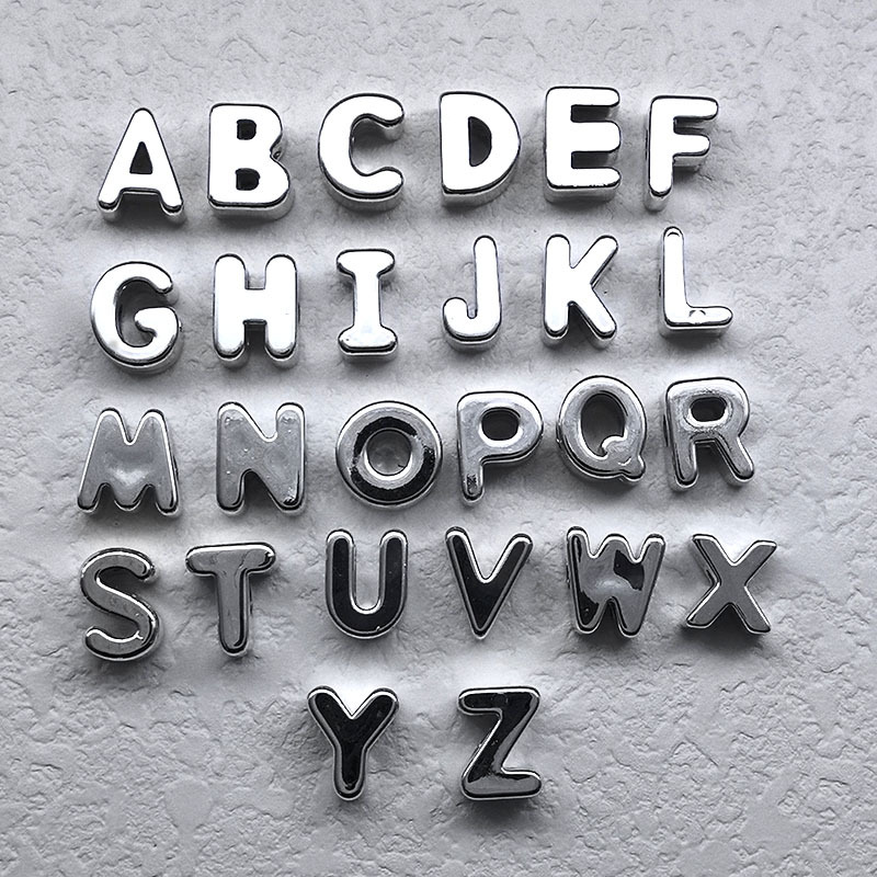 Silver letters mixed randomly (pieces)