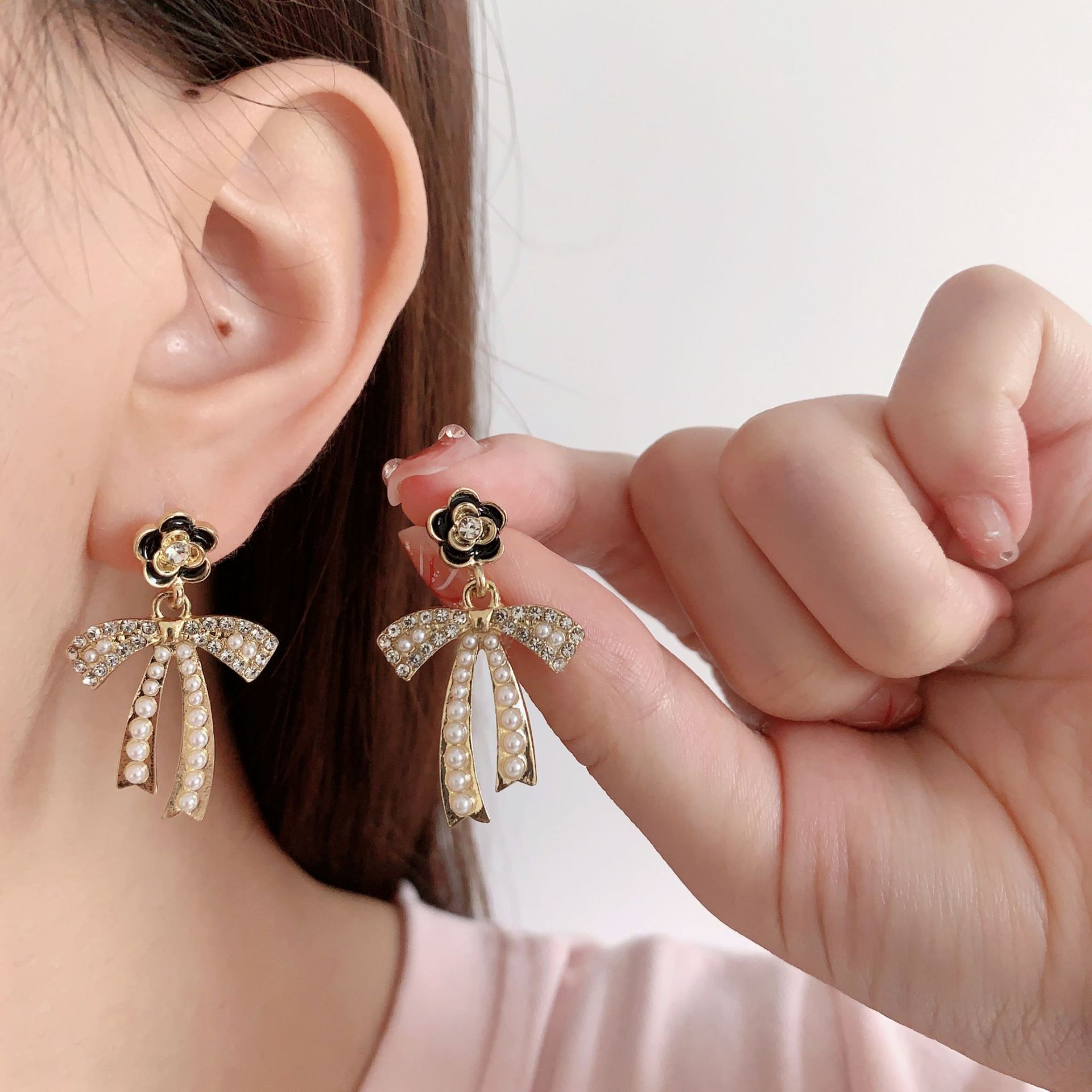 Fashionable elegant earrings with bow