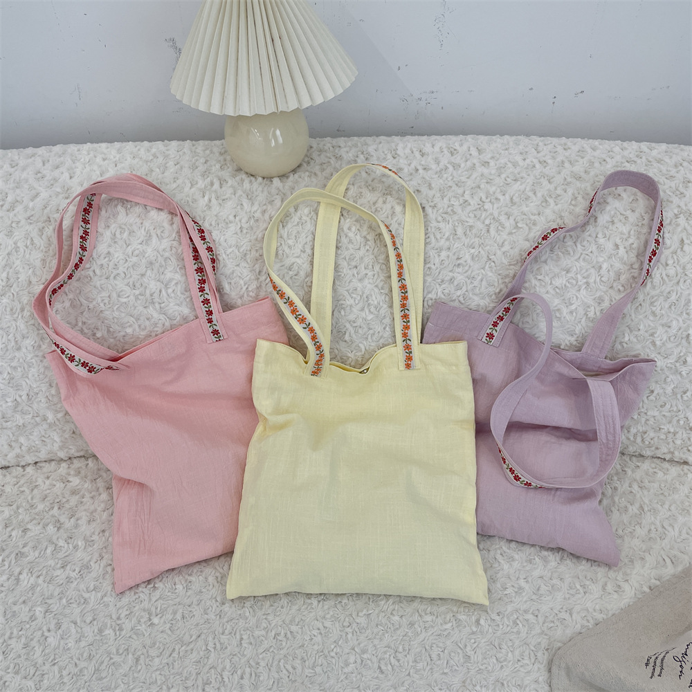54182トートバッグ女性2025新型花は大容量手提げ袋をつなぎ合わせて授業中の通勤ショルダーバッグ