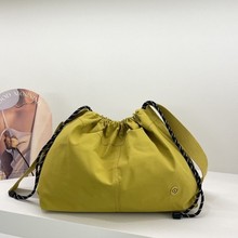 抽绳简约尼龙布托特包女2025新款校园风大容量ins休闲单肩斜挎包