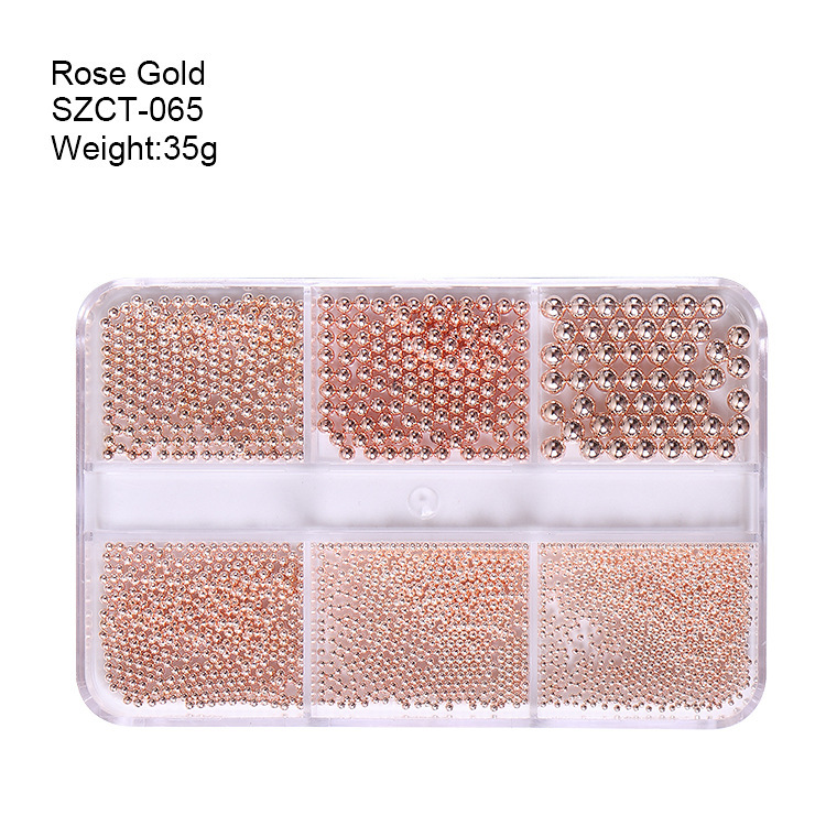 Accesorios de uñas transfronterizos al por mayor 6-grid nail aleación de acero cuentas oro plata tamaño mezclado decoraciones de uñas al por mayor
