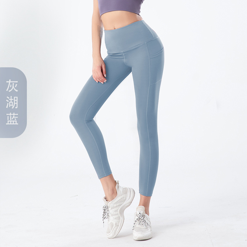Amazon tamaño europeo pantalones de yoga transfronterizos bolsillo lateral de las mujeres melocotón cintura alta Levantamiento de cadera medias de fitness europeas y americanas