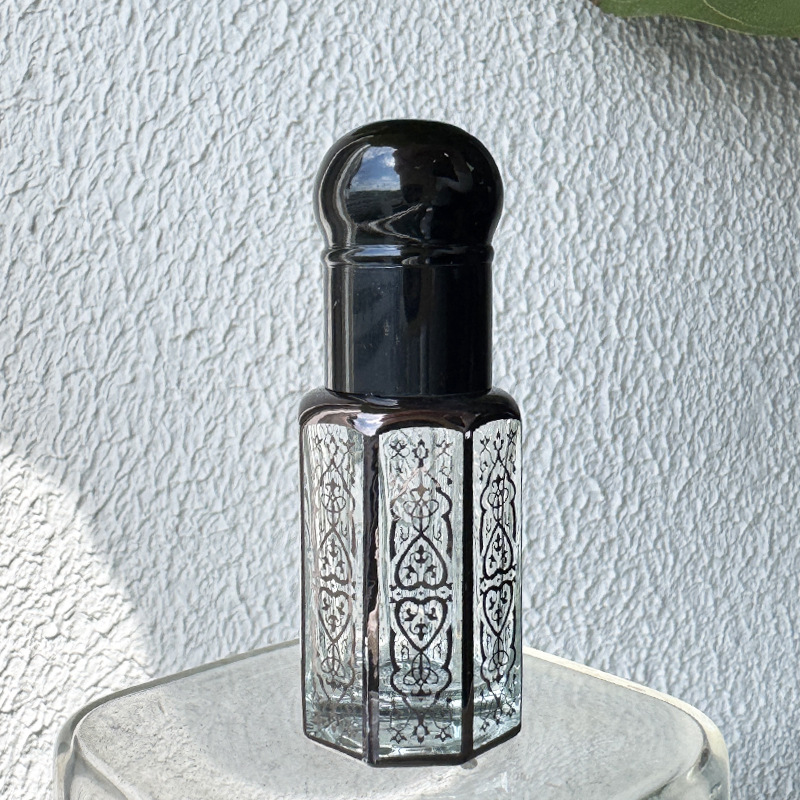 Botella de aceite de cristal revestido con láser, sub-embotellado, botella de perfume con cuentagotas sellada en espiral, fabricante de botellas de bolas rodantes al por mayor octogonal