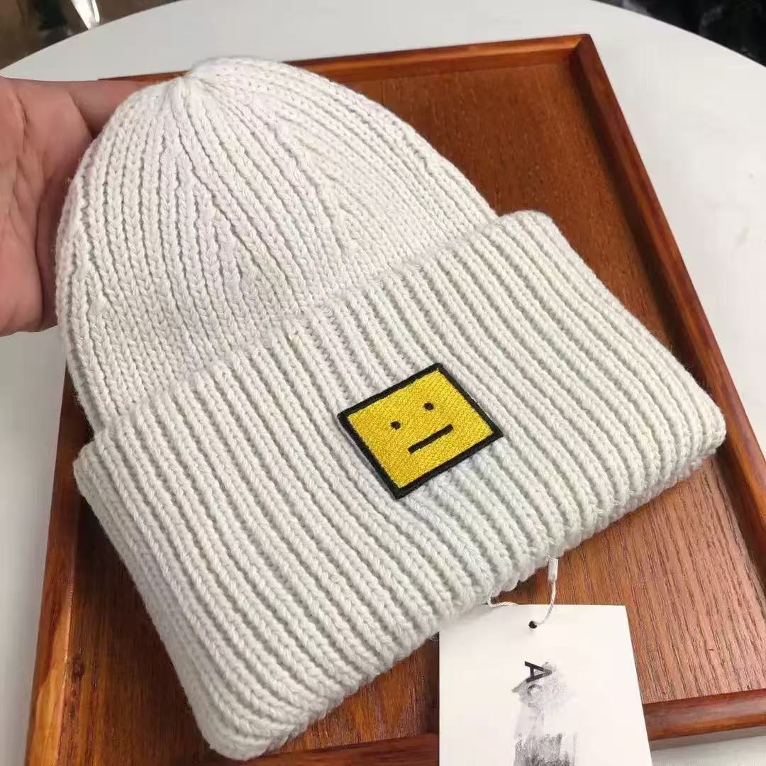 AC笑顔の帽子の四角のラベルを貼って、ウールの北欧風の冷たい帽子の韓国版のカップルの毛糸の帽子の高品質の冷たい帽子を巻きます。