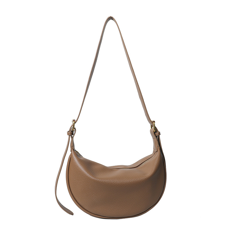 Bolso de mochila simple y popular, bolso de mujer de estilo extranjero 2024, nuevo verano coreano, bolso de hombro casual de color sólido.