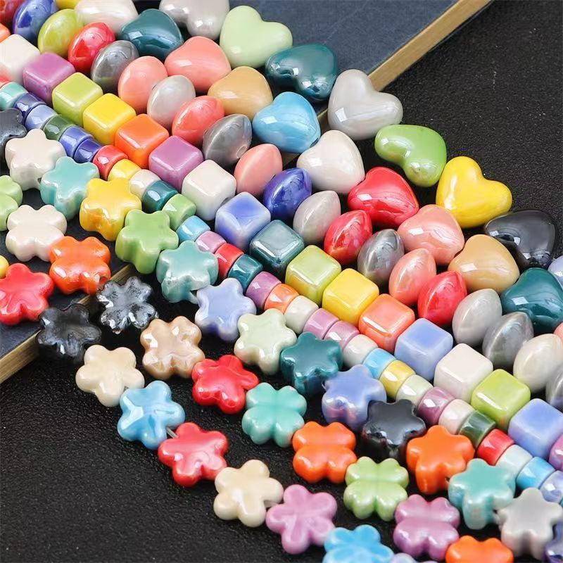 Cerámica de color simple perlada cara de pez cinco pétalos perlas de flores perlas sueltas diy accesorios de decoración de brazalete de cuentas hechas a mano