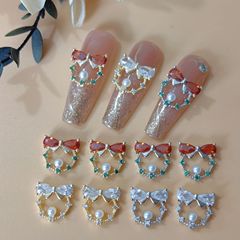 圣诞花环美甲饰品2025新款珍珠立体蝴蝶结超闪水滴锆石指甲钻饰品