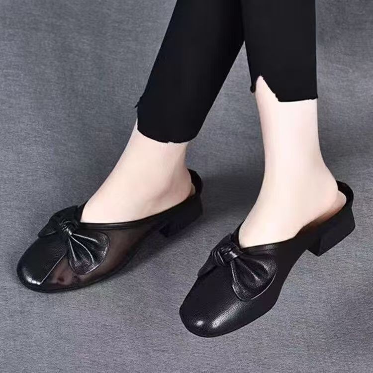 Zapatillas de piel suave de tacón bajo para mujeres primavera y verano 2026 nuevas zapatillas de tela plana para la cabeza de la bolsa para usar zapatillas de mujer