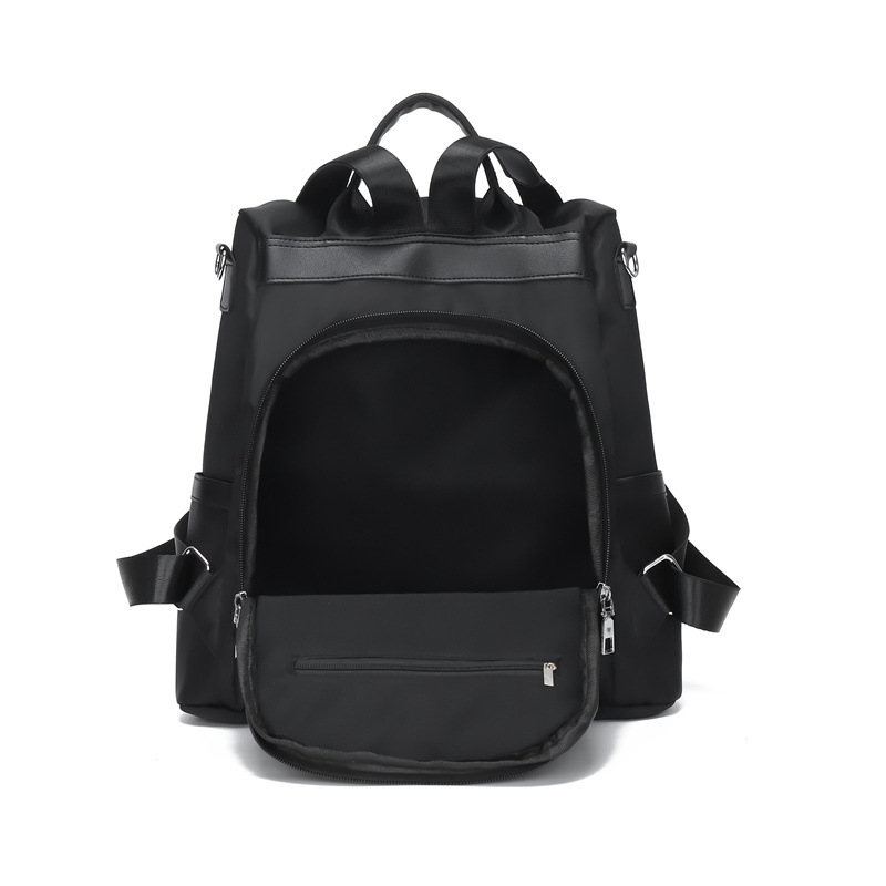 2024 nueva mochila Oxford casual para mujer, remache de moda, mochila de viaje de todo fósforo de color sólido al por mayor