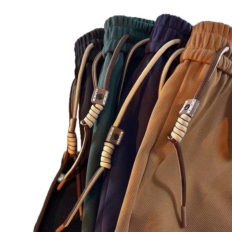 Pantalones cortos deportivos compactos para hombres de verano marca de moda retro espuma impresa pantalones casuales pantalones cortos sueltos de cinco puntos