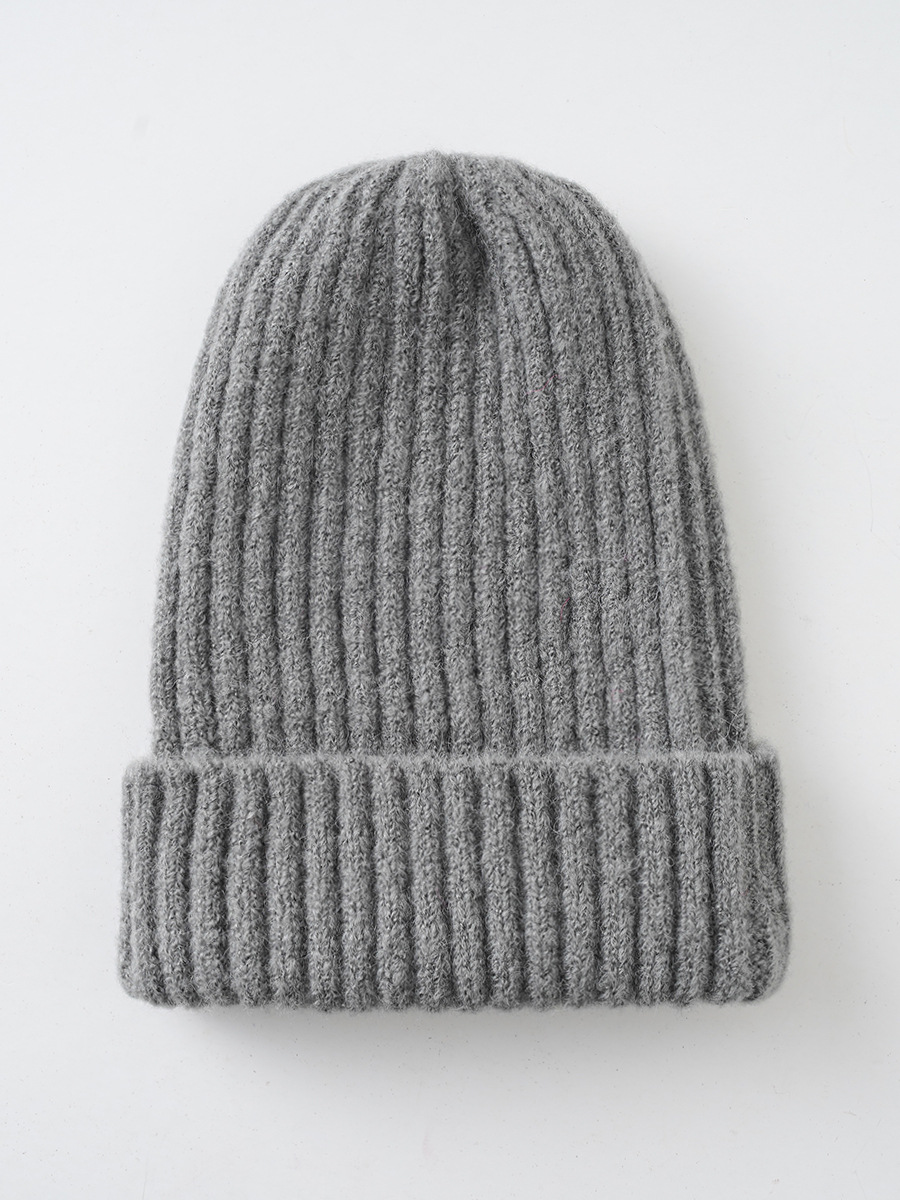 Sombrero de invierno de las mujeres estilo coreano nuevo color caramelo color sólido sombrero de lana cálido sombrero de punto de rayas verticales moda