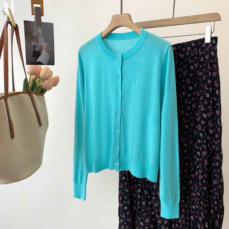 Spring knitted sweater with a round collar