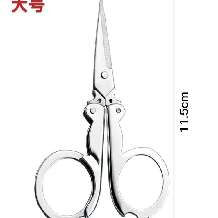 折り畳み式ハサミの文房具は魚の糸を切って携帯のハサミを切ります。|undefined