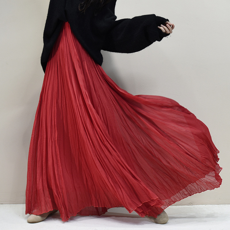 Elegant nude pink pleated chiffon long skirt with a full hem, elastic high waist, hip-covering, and a flowing, elegant design Elegant nude pink pleated chiffon long skirt with a full hem, elastic high waist, hip-covering, and a flowing, elegant design
