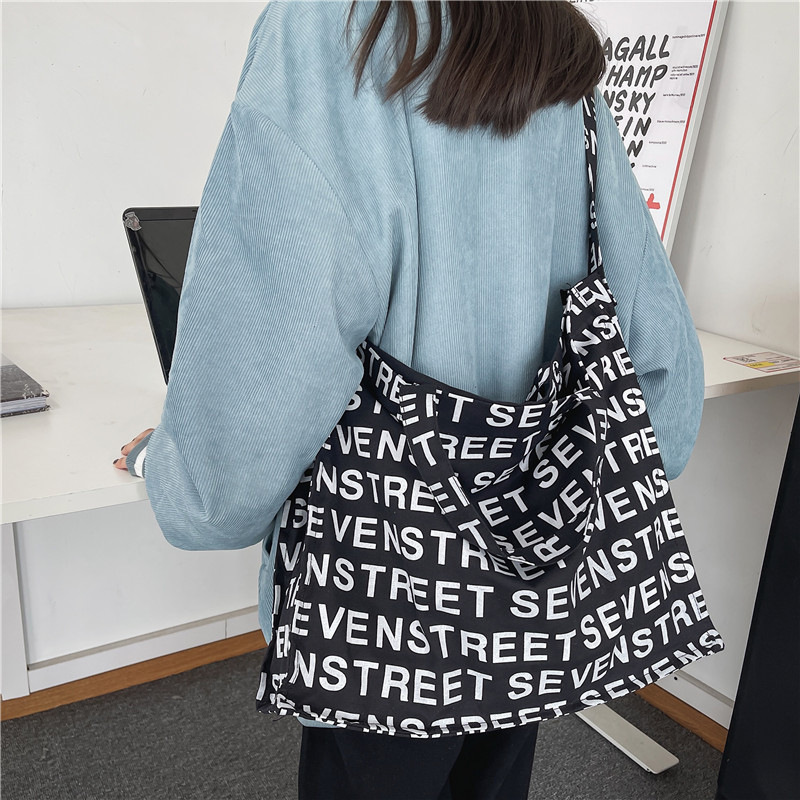 Bolso Tote de lona de gran capacidad para mujer 2024 nuevo bolso de hombro de estilo occidental de moda casual bolso de mensajero portátil de todo fósforo marea