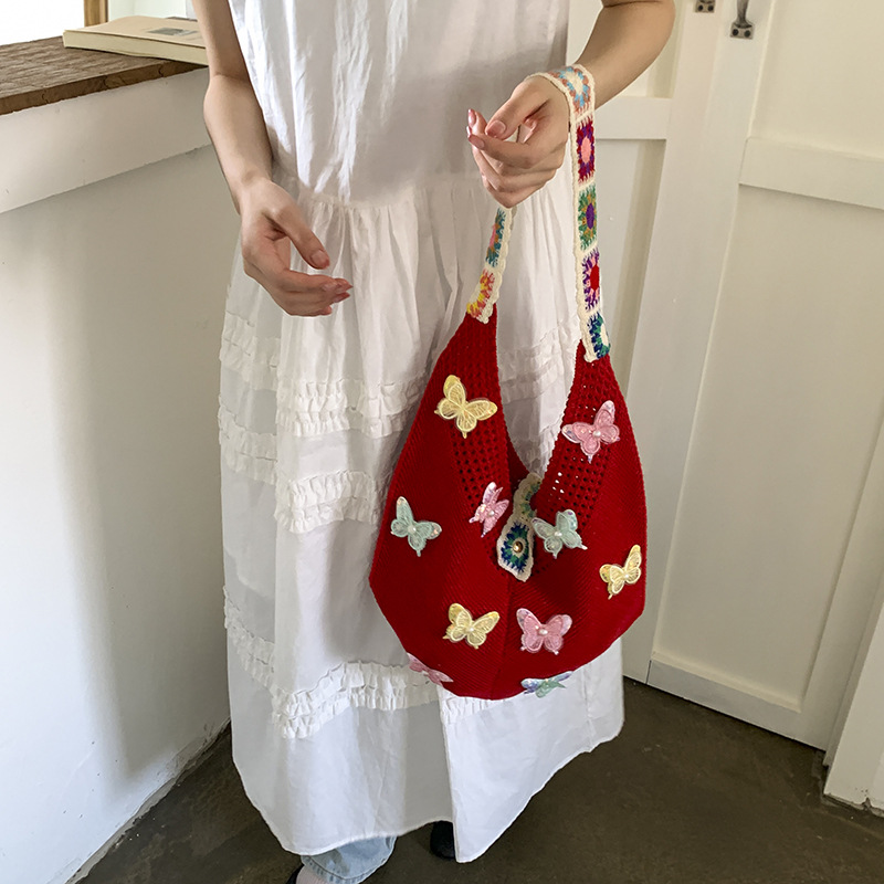 Versión coreana del bolso de nicho 2025 verano nuevo bolso femenino mariposa bolso tejido bolso de hombro de punto de gran capacidad