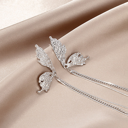 Silver needle personality cool style bumpy texture asymmetric butterfly tassel earrings Hong Kong style liquid butterfly long earrings