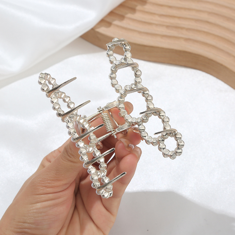 Elegant Star Bow Knot Shell Alloy Plating Hollow Out Inlay Rhinestones Pearl Hair Claws display picture 1