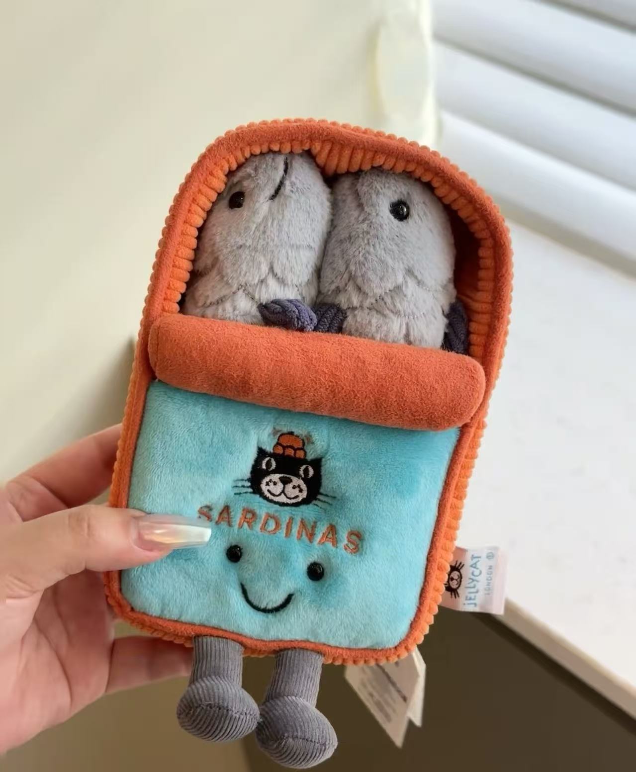 Canned sardines + dust bag