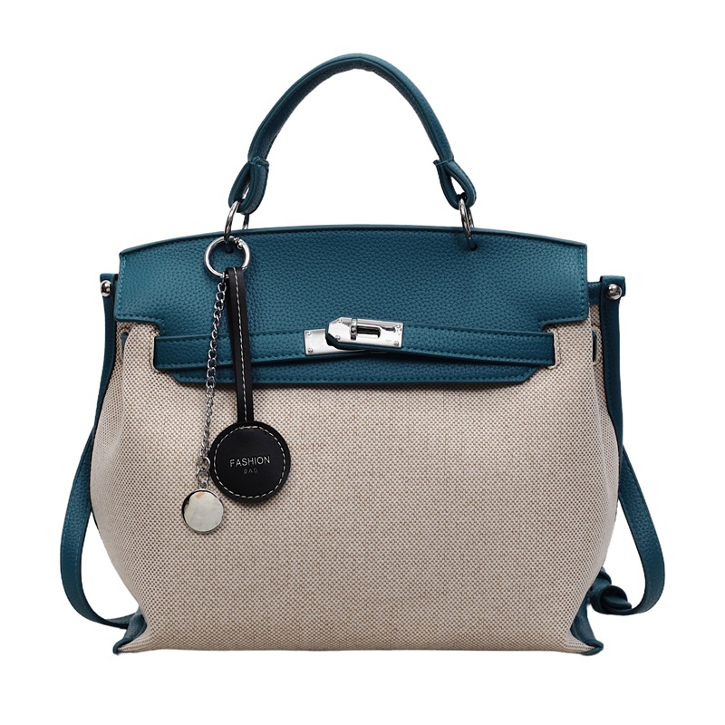 Bolso para mujeres 2026 nuevo cross-border lienzo empalme color contraste bolso de mano alta sensación retro mochila de hombro