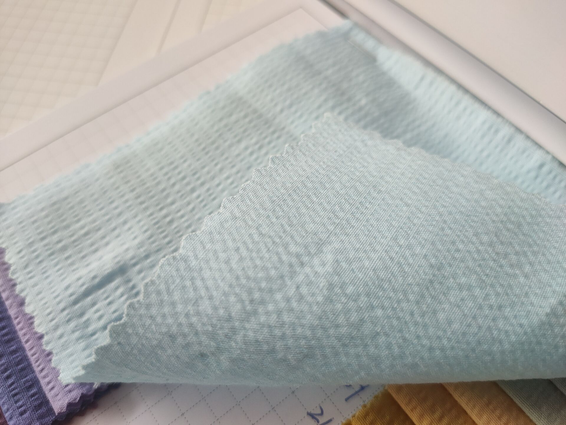 2021春夏女装童装凸点纹砂洗面料连衣裙娃娃衫棉泡泡布绉布质感