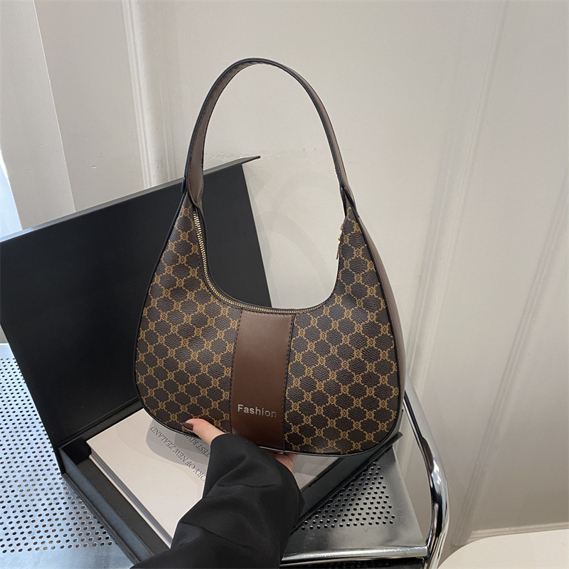 Arte y literatura color contrastante empalme viaje bolso de media luna portátil retro 2025 personalidad nueva moda braza de hombro bolso de mujer