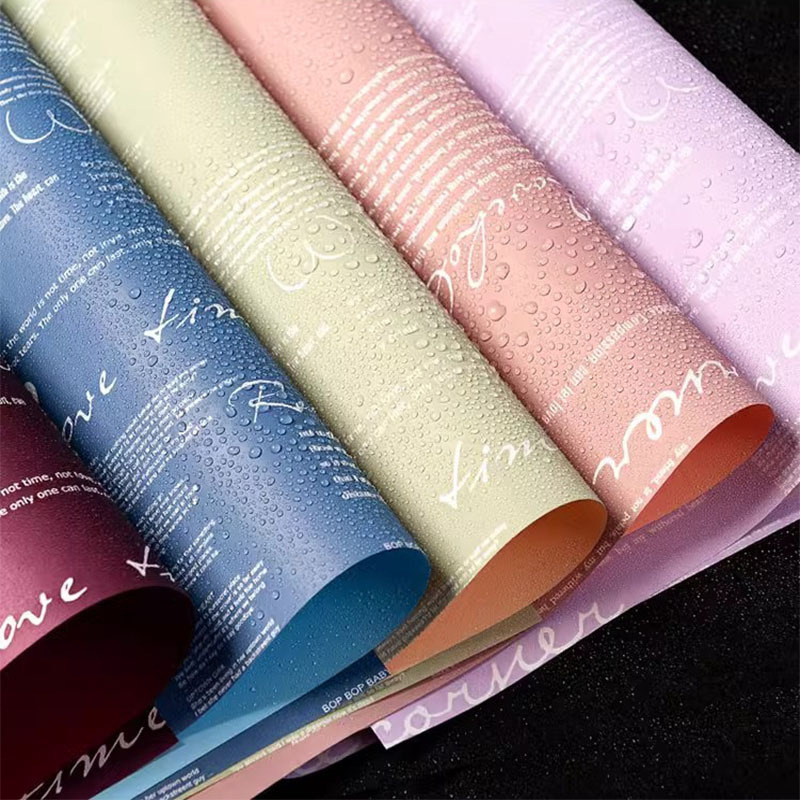 Fábrica de fiestas de flores nuevos productos transfronterizos periódicos en inglés diseño de paquetes de flores de dos colores paquetes de flores de papel florista materiales de embalaje