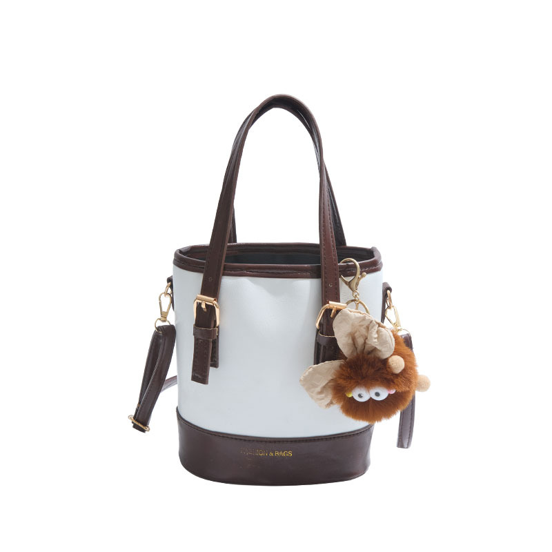 2025 nueva moda extranjera coreana bolso de cubo de mano simple ocio empalme viaje mochila de hombro para mujeres
