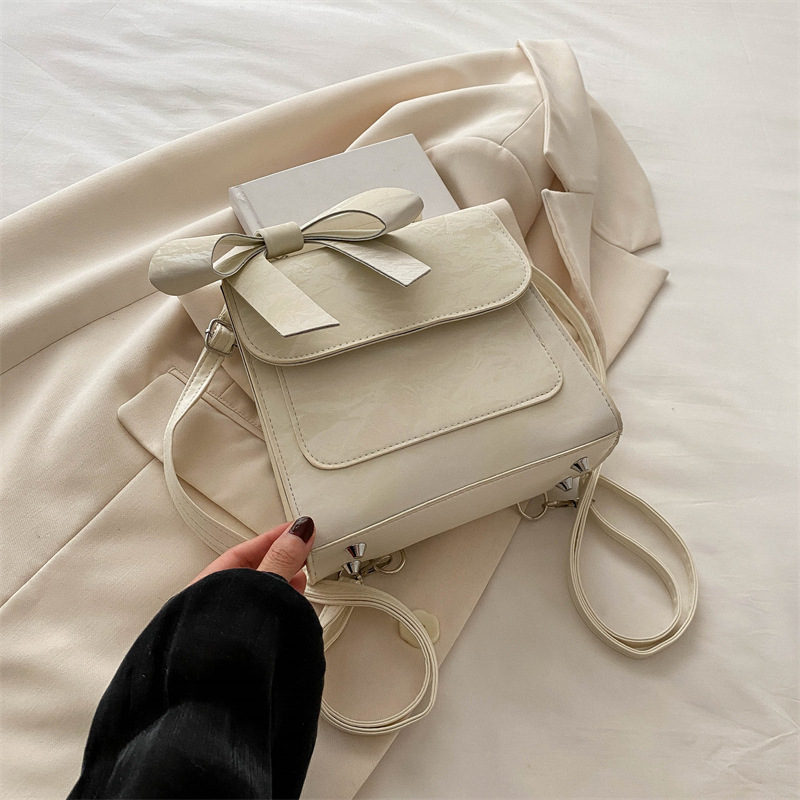 Mochila de hombro de arco para mujeres 2024 nueva moda estilo académico mochila de estilo universal bolso de mano bolso de viaje