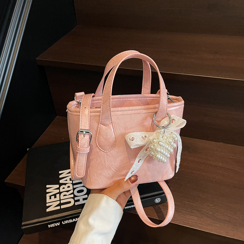 Bolso Tote popular de este año 2025 verano nuevo bolso bolso de hombro con patrón de agarre lindo bolso de mensajero de todo fósforo mujer