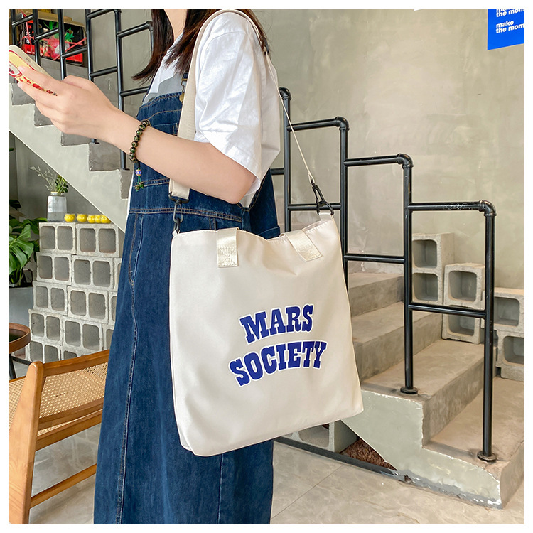 Canvas bag for women, single shoulder, ins crossbody, laid-back style, college student class bag, artistic Japanese style, large capacity, Hong Kong style, chic undefined