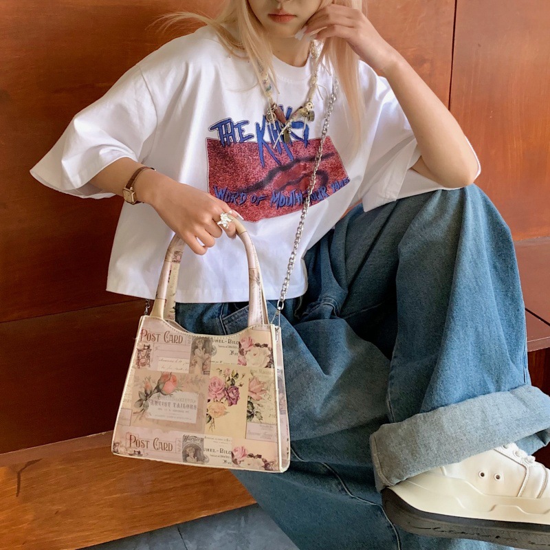 Bolso de moda europeo y americano 2025 verano nuevo bolso femenino cartel retro bolso de hombro cadena de personalidad bolso de mensajero marea