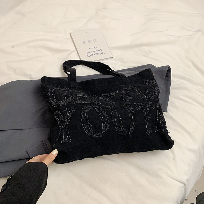 Nueva mochila de hombro de mezclilla retro, bolso de lona con letras de ocio, bolso de viaje artístico para estudiantes