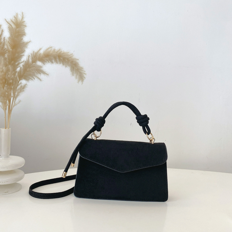 2024 otoño y invierno temperamento diseño de moda de un solo hombro aire extranjero color sólido retro textura simple bolso portátil