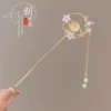 Fuchsia Chinese hairpin with tassels, cat's eye