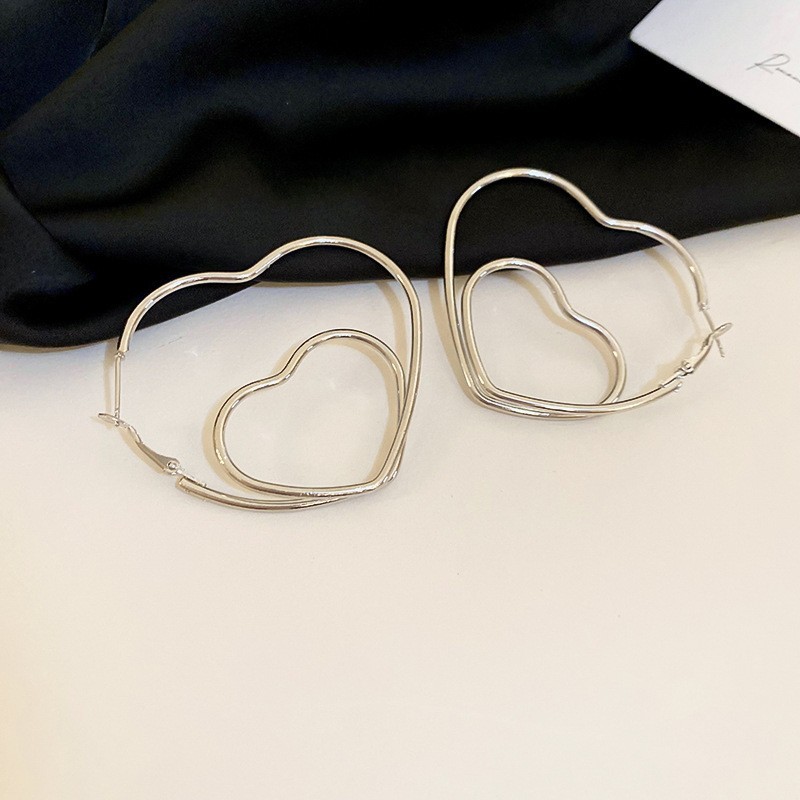 Pendientes de metal transfronterizos de otoño e invierno con aguja de plata, pendientes, pendientes de viento frío de moda de nicho, pendientes de lujo de alta gama de luz de todo fósforo