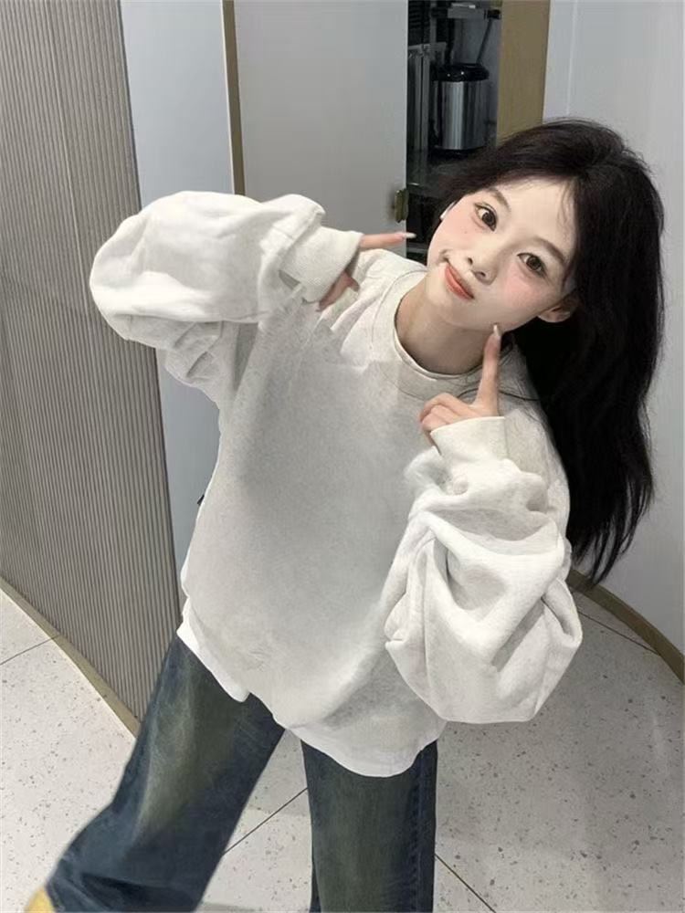 Hong Kong vientos de diseño americano cuello redondo camiseta de manga larga mujer suelta chaqueta alta calle de color sólido invierno / otoño blusa