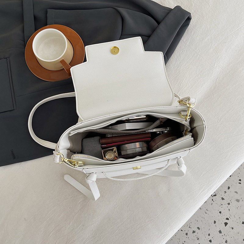 Texturas de moda transfronterizas bolsas de alas portátiles mujeres 2024 primavera nuevo nicho de diseño extranjero bolsas de hombro