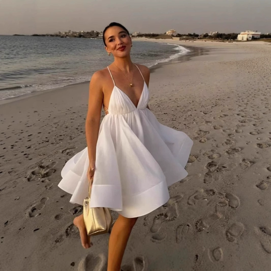 2025 ранняя летняя новая трансграничная европейская и американская мода для отдыха, однотонное пышное платье на тонких бретельках с открытой спиной и глубоким v-образным вырезом.