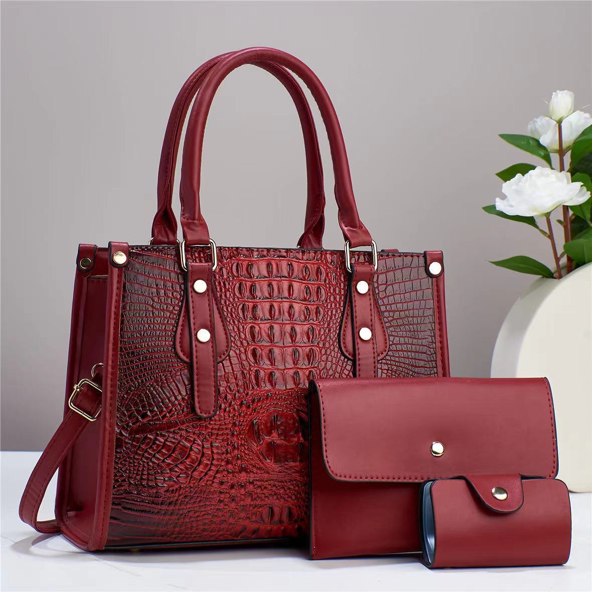 Bolso de mujer de moda popular 2026 nuevo transfronterizo de tres piezas europeas y estadounidenses paquete de bolso de madre para mujeres de viaje universal mochila de hombro