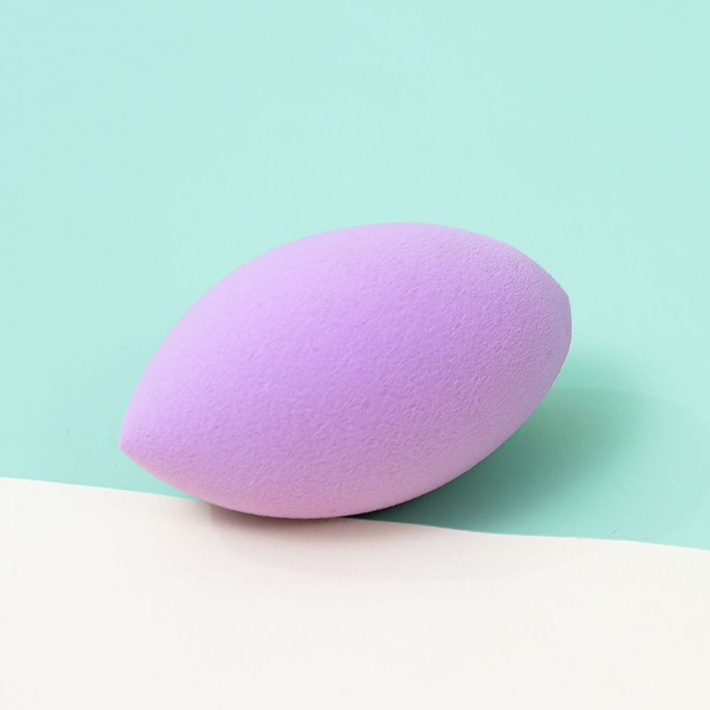 Fábrica personalizada ovalada belleza huevo soplo de polvo no come polvo no látex transfronterizo rugby maquillaje esponja huevo cojín de aire