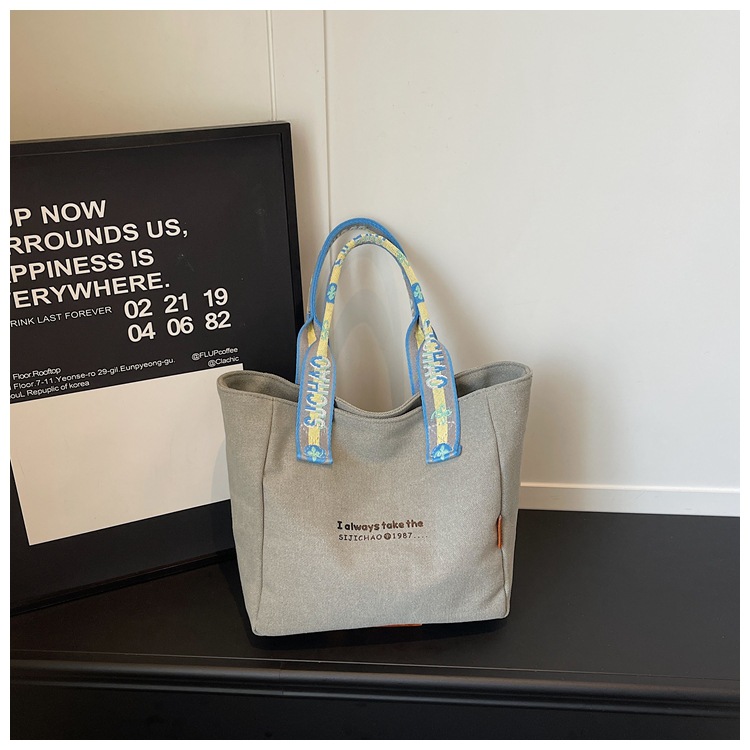 Bolso de lona de gran capacidad para mujeres 2026 verano nuevo bolso de mano ligero y simple para viajar bolso de ocio bolso de mamá