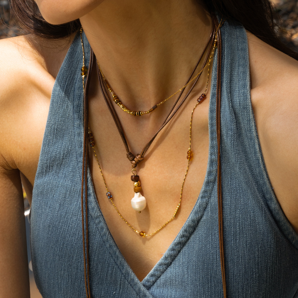 Collar de acero inoxidable TENA Europa y América de lujo ligero nicho largo collar de perlas de cuerda ligero lujo alto sentido de venta caliente transfronteriza