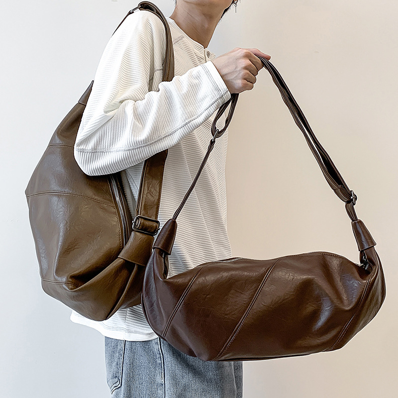 2026 new Korean-style niche retro handbag for women, casual and versatile shoulder bag, fashionable and relaxed style, horn-shaped bag