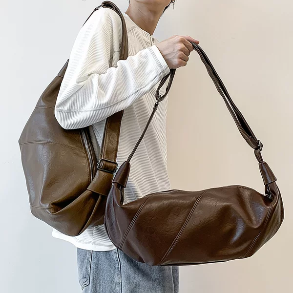 2026 new Korean-style niche retro handbag for women, casual and versatile shoulder bag, fashionable and relaxed style, horn-shaped bag