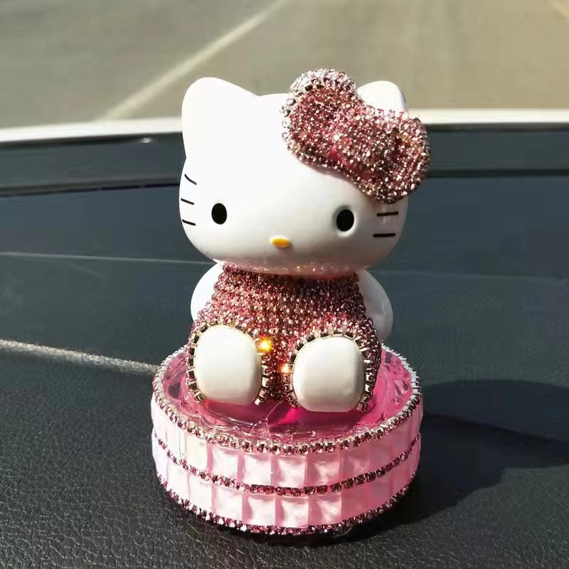 Un conjunto de adornos de automóviles adorables un conjunto de adornos de Buda más almohadilla de polvo blanco bola de diamante cisne botella decoración cerámica