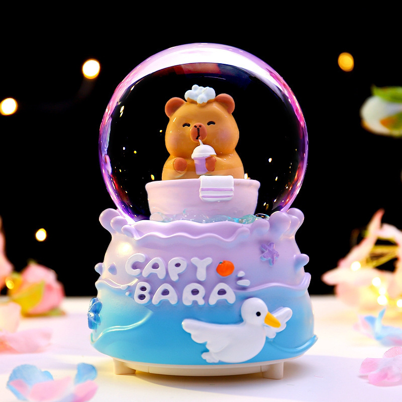 Red roja caliente Kapibala bola de cristal caja de música nieve que brilla estudiantes niños regalos navideños decoración de la habitación