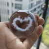 Internally engraved ball hollow heart shape