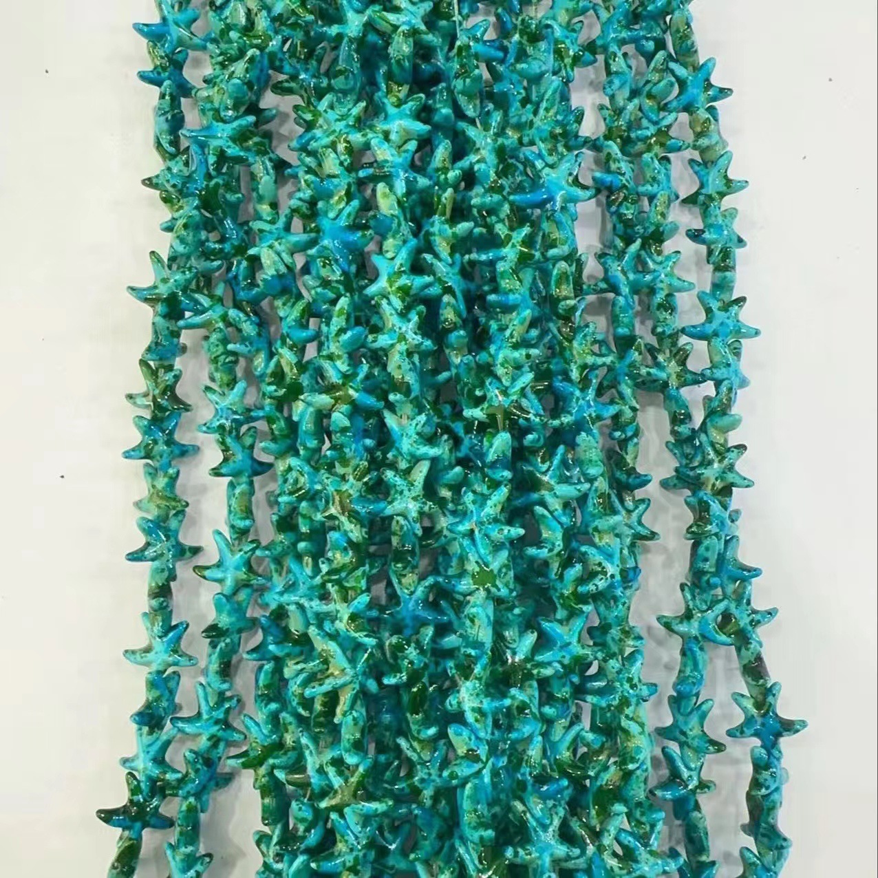 Ventas transfronterizas de coloridas estrellas de mar de piedra de pino cuentas semiacabadas DIY accesorios accesorios materiales de joyería hecha a mano